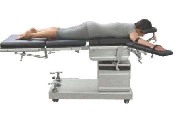 Spine Surgery In Prone Position Using Horse Shoe Headrest Cushioned Spine Frame