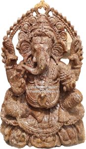 Polished Brown Sitting Ganesh Stone Statue, Packaging Type : Box